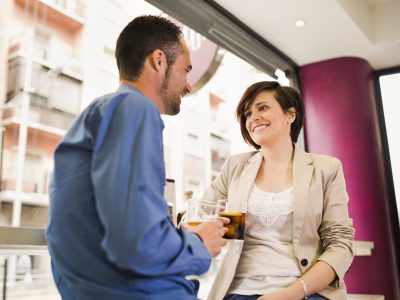 Couple dating in bar, smiling and talking