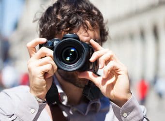 Man shooting photograph